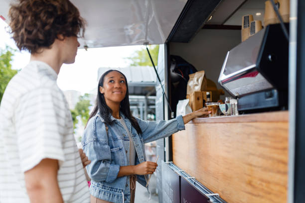 istock Interracial Couple Ordering Coffee at an Outdoor Cafe 2154878173