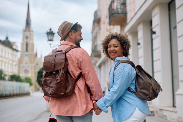 istock Happy mature couple holding hands while enjoying their trip. 2154879087