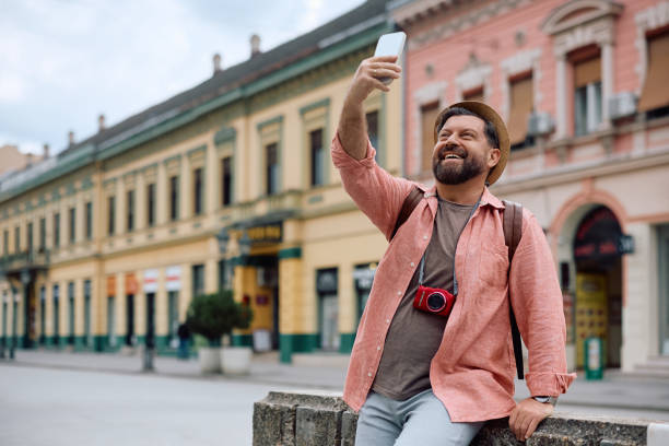 istock Happy tourist talking selfie while sightseeing in the city. 2154879620