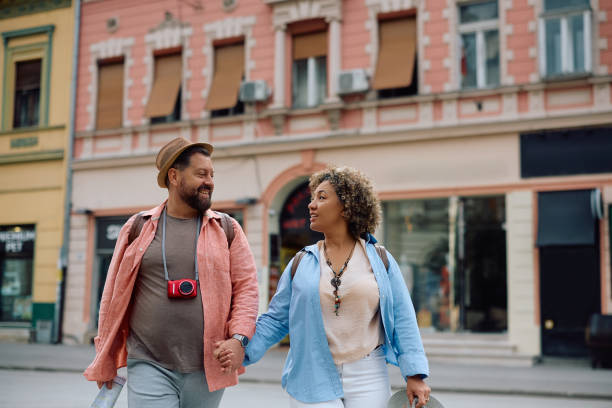 istock Mature couple holding hands while sightseeing in the city. 2154880032