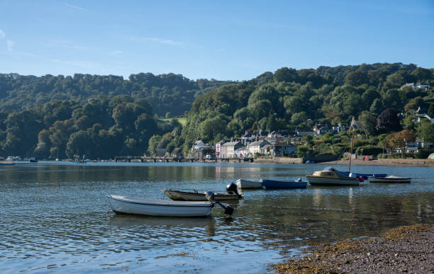 Boats moored along the shore from Dittisham, Devon, United Kingdom