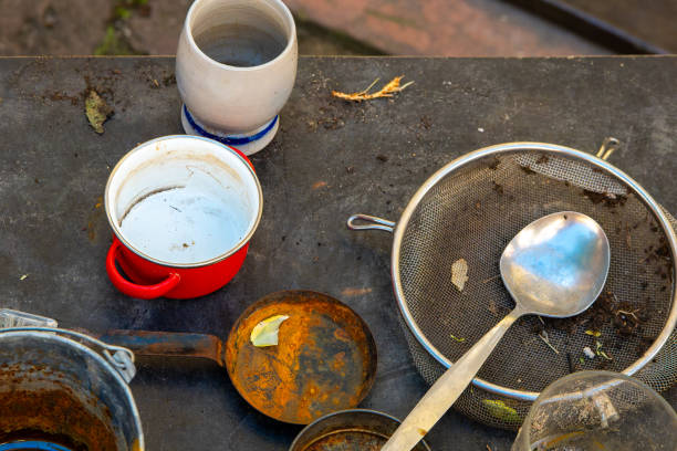 istock dirty table with a red bowl, a white bowl, a spoon, and a spatula 2154880424