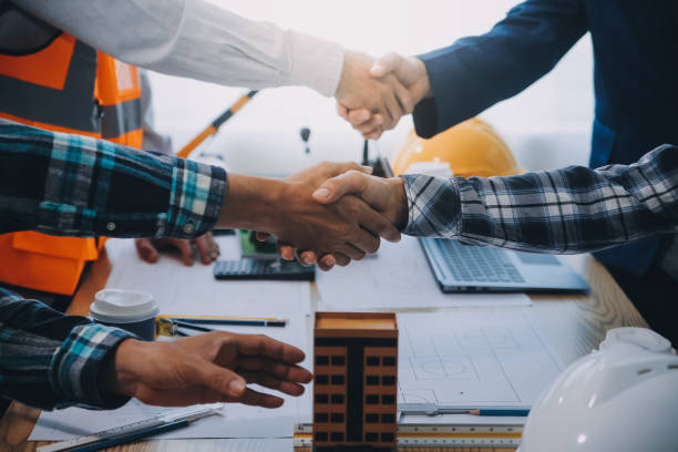 istock Image of engineer meeting for architectural project. working with partner and engineering tools on workplace vintage tone. 2154881879