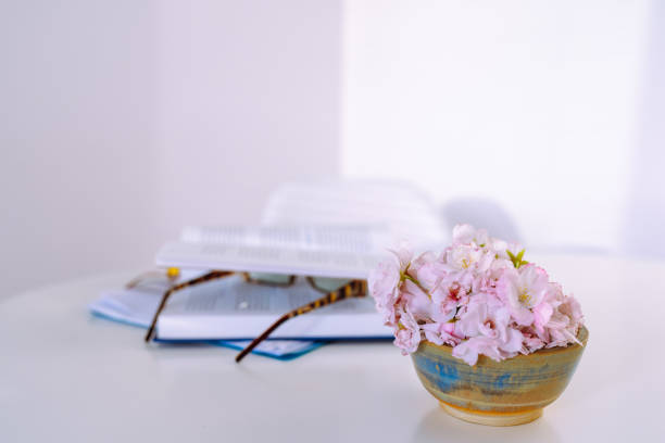 Shelf with books and flower