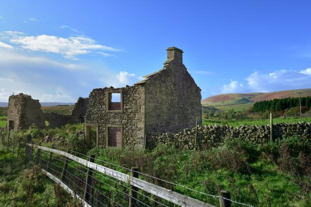 istock Farmhouse ruins with illegal fly tipping inside 2154884739