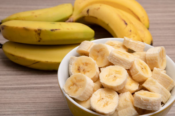 istock sliced ​​banana inside a white bowl jar 2154887227