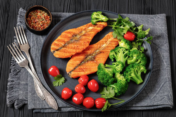 istock grilled salmon steaks with broccoli and tomatoes 2154891761