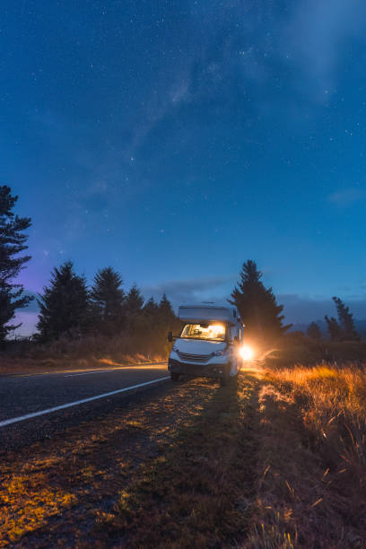 istock Milky way with starry in night sky and motorhome parked on roadside 2154894251