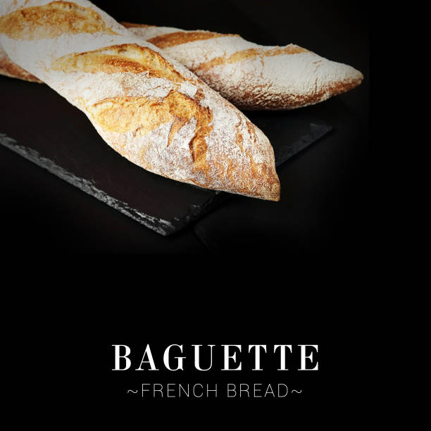 istock French baguette isolated on black background. 2154894788