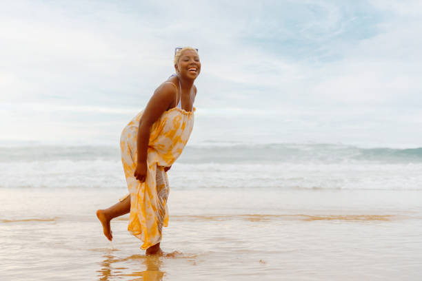 istock curvy girl on the beach 2154895443