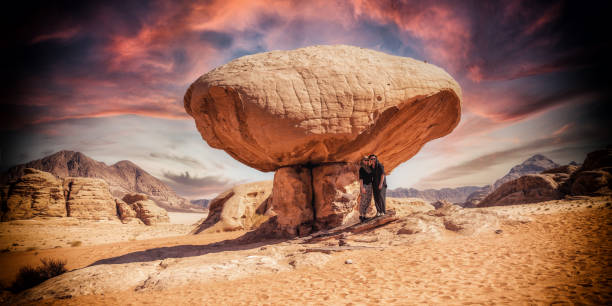Two women under the mushroom rock