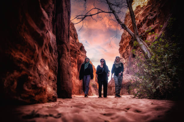istock Three girls walking through the desert 2154896703