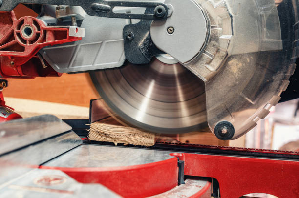 istock Carpentry machine circular saw cuts a board in carpentry workshop 2154899902