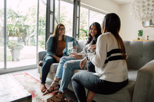 istock Three young friends relaxing at home 2154901265