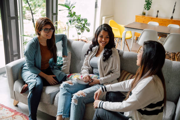 istock Three young friends relaxing at home 2154901291