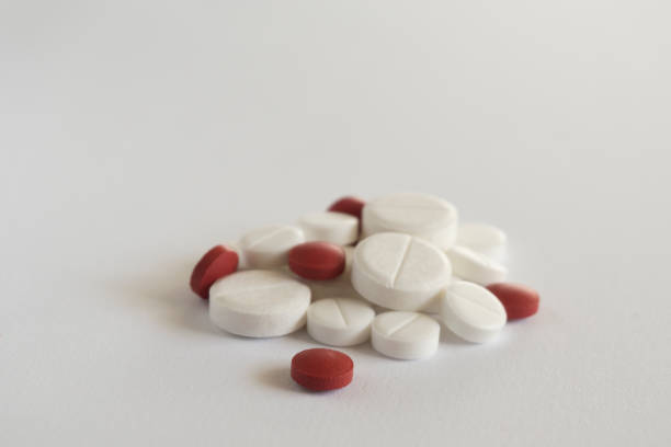istock White and red pills on twite background 2154901482
