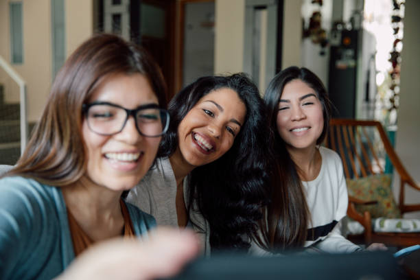 istock Three young friends shoot a selfie at home 2154901569