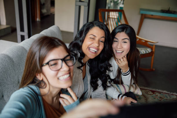 istock Three young friends shoot a selfie at home 2154901601