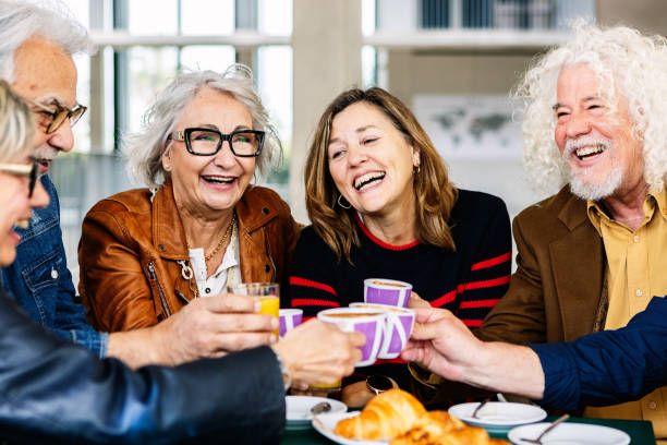istock Senior group of retired people celebrating while having breakfast together 2154902203