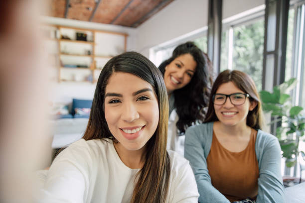 istock Three young friends shoot a selfie at home 2154902317