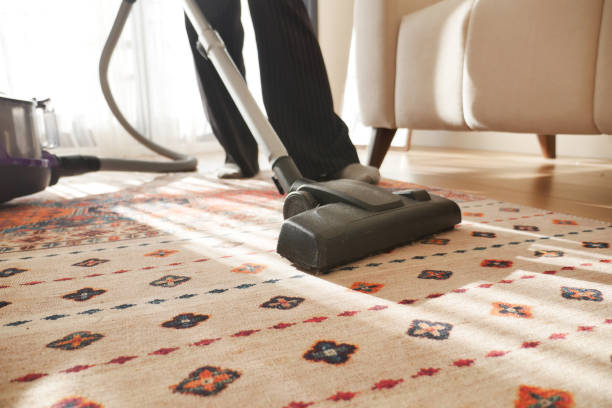 istock women cleaning with vacuum cleaner carpet, 2154903789