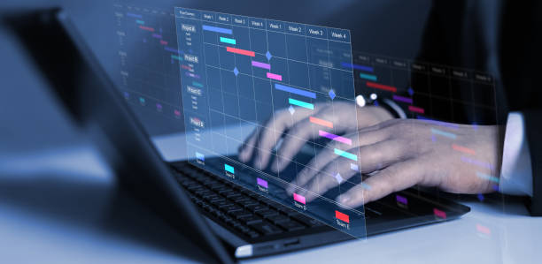istock Business Project Management System.Project manager updating tasks and milestones progress planning with Gantt chart scheduling interface for company. 2154904327
