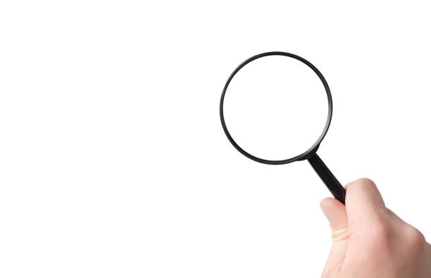 istock lens, black magnifying glass in hand in hand on a white background 2154904939