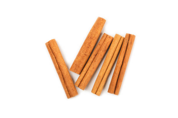 istock Cinnamon sticks on background. Cinnamon roll. Spicy spice for baking, desserts and drinks. Fragrant ground cinnamon. cinnamon powder Close-up. Place for text. copy space 2154906559