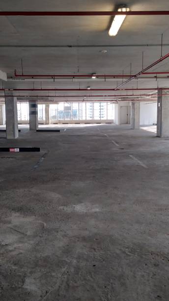 istock Parking spaces at building level, city 2154907223