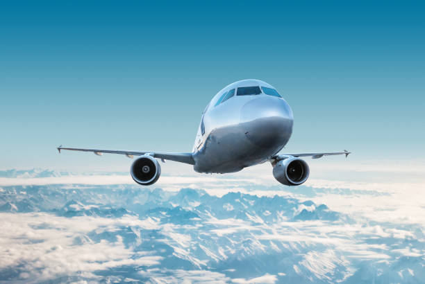istock Passenger airplane flying in the air over snow covered mountains 2154907963