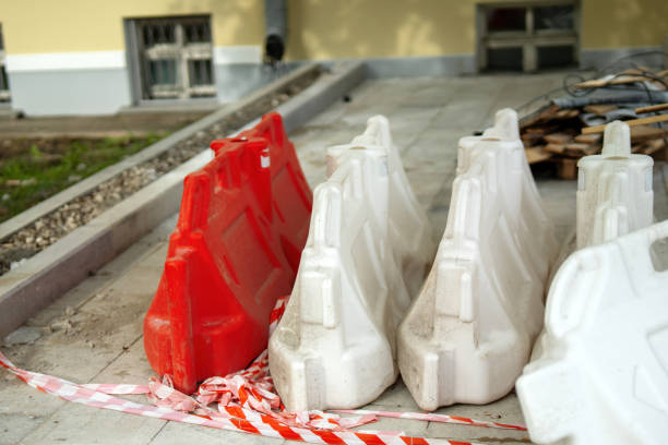 Red and white water-filled barriers for portable containment