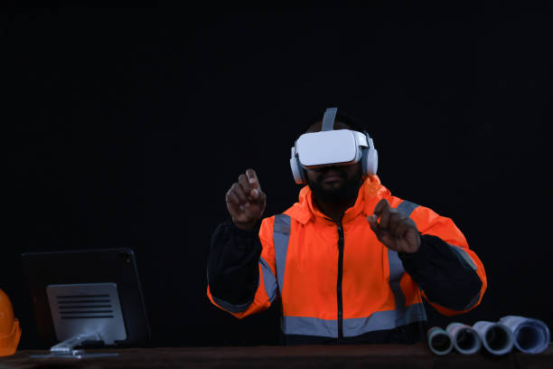 istock A Male Industrial Engineer Wearing a Virtual Reality Headset and Holding Controllers, He Uses VR technology for Industrial Design, Development, and Prototyping in CAD Software. 2154910944