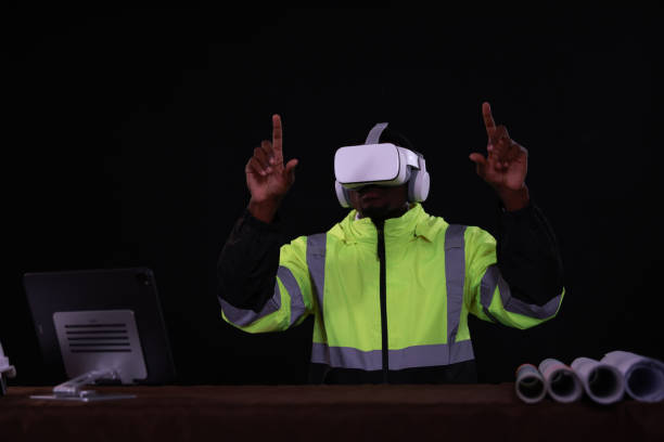 istock A Male Industrial Engineer Wearing a Virtual Reality Headset and Holding Controllers, He Uses VR technology for Industrial Design, Development, and Prototyping in CAD Software. 2154910952