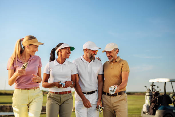 istock Friends talking to each other on a field after a golf game 2154914548