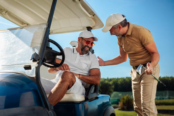 istock Golfers talking by the golf cart 2154914552