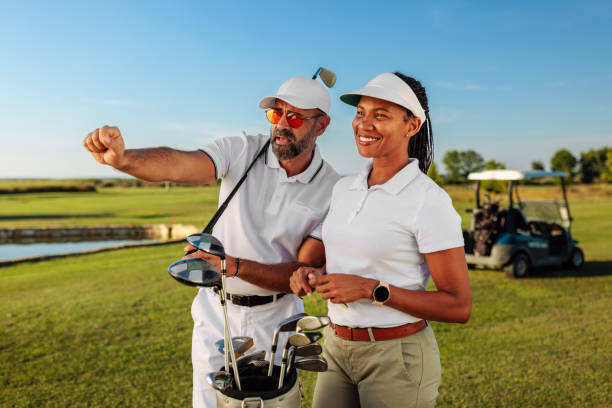 istock Golf teacher explaining something to his female student 2154914576
