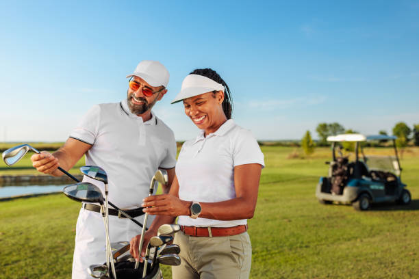 Two golfers choosing the best golf club for the next shot