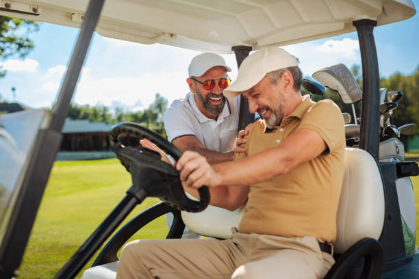 istock Two golfers laughing on a golf court 2154914578
