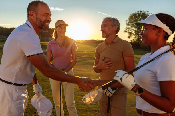 istock Golfer friends shaking hands on the golf court 2154914619