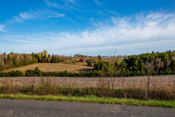 istock Wisconsin farmland with red barn in April 2154915581