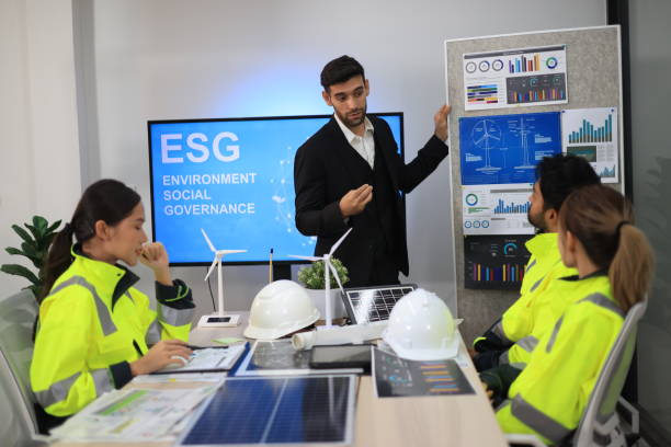 istock Diversity  Office Conference Room. White people's head leader does Presentations for energy engineers, Talking, Using TV with Infographics, Statistics, and Graphs. Businesspeople Invest in Startup for Wind Turbine Project. 2154915992