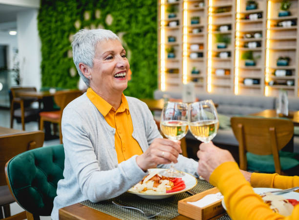 istock Wife and husband toasting with wine at a restaurant 2154916418