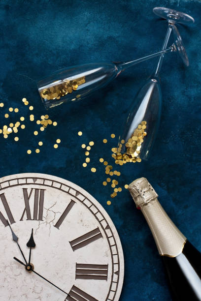 istock Champagne bottle and glasses  with Christmas  clock. Flat lay 2154917291