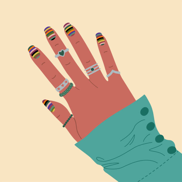 istock Female hand with stylish colored manicure and silver rings. 2154918568