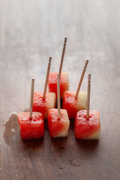 istock Close-up of Watermelon (Citrullus Lanatus) fruit Cubes with bamboo sticks. 2154919682