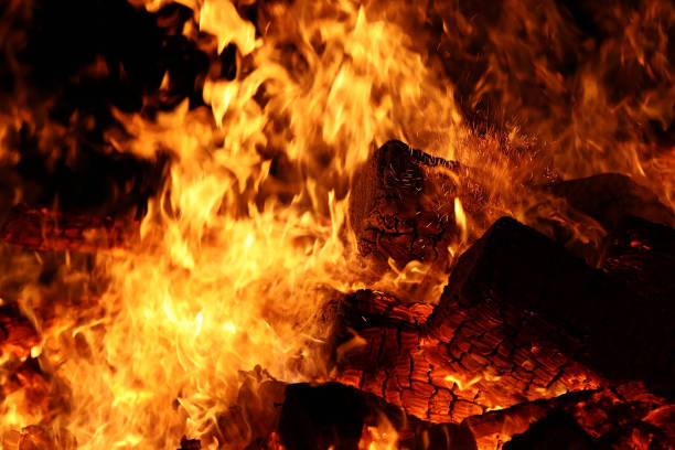istock Burning wood with flying sparks 2154923730