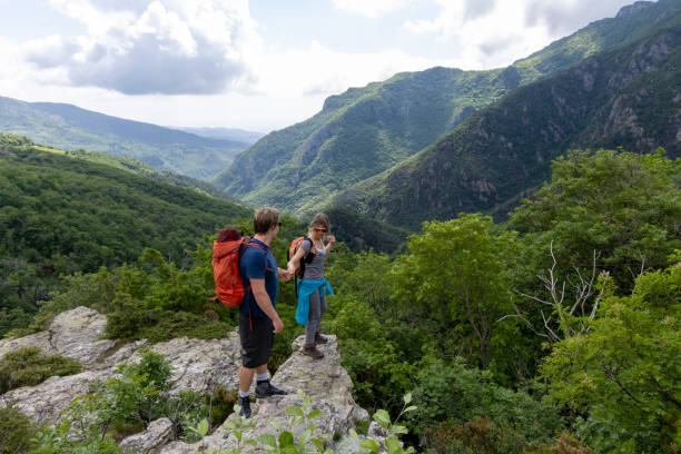 istock Hiker offers friend a helping hand 2154923813