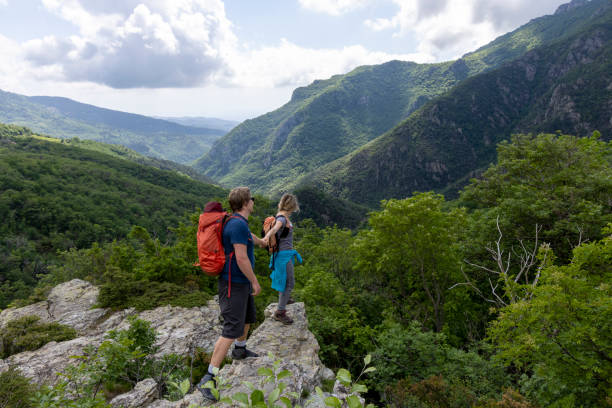 istock Hiker offers friend a helping hand 2154923814