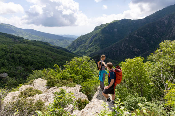 istock Hiker offers friend a helping hand 2154923874