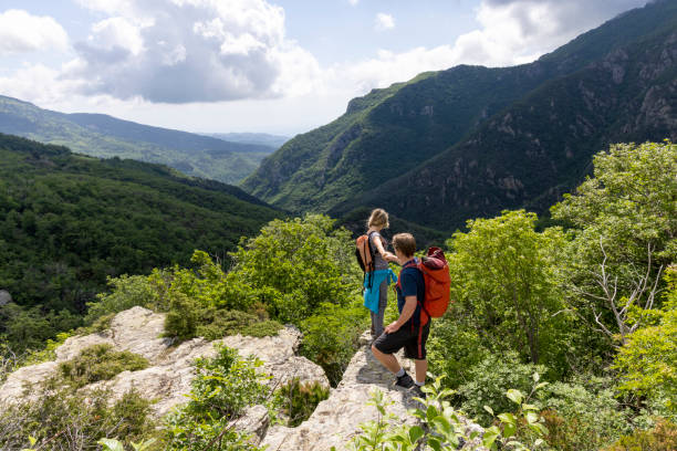 istock Hiker offers friend a helping hand 2154923885